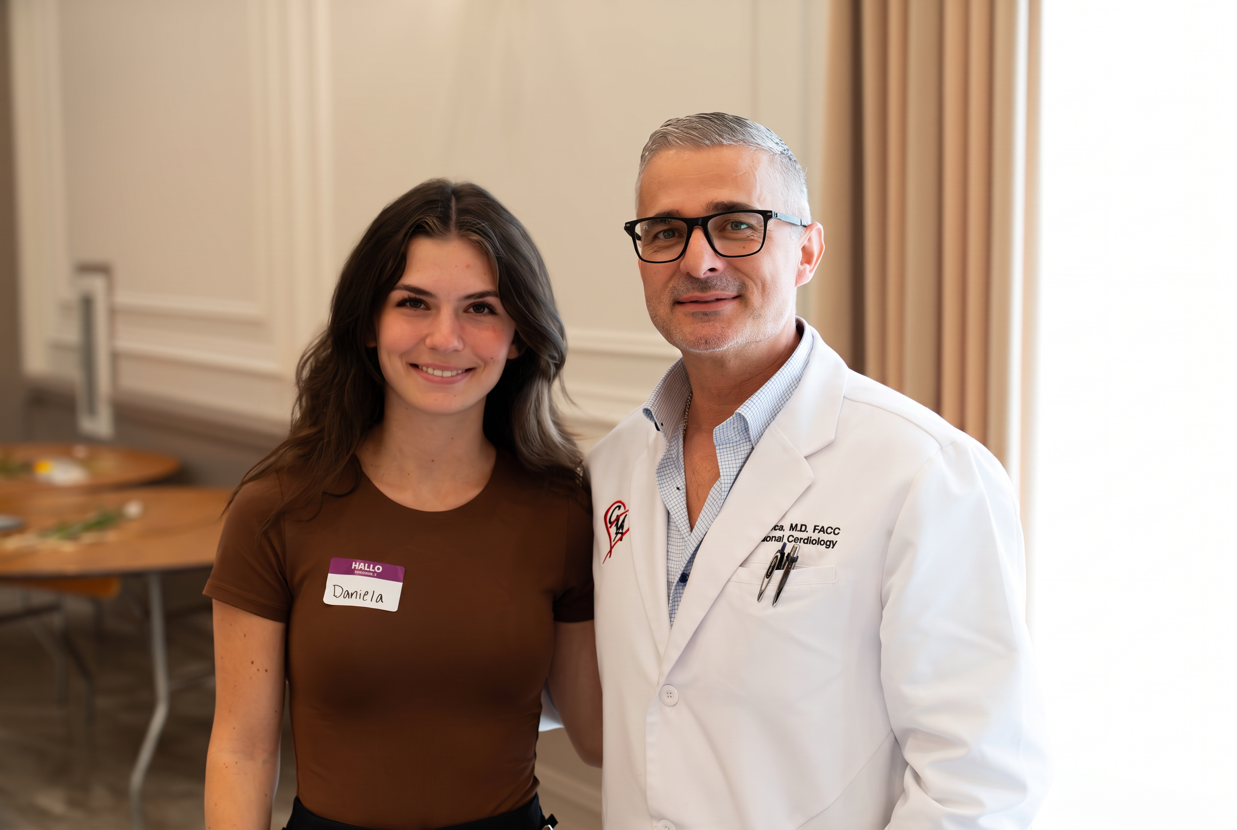 A cardiologist with a student volunteer
